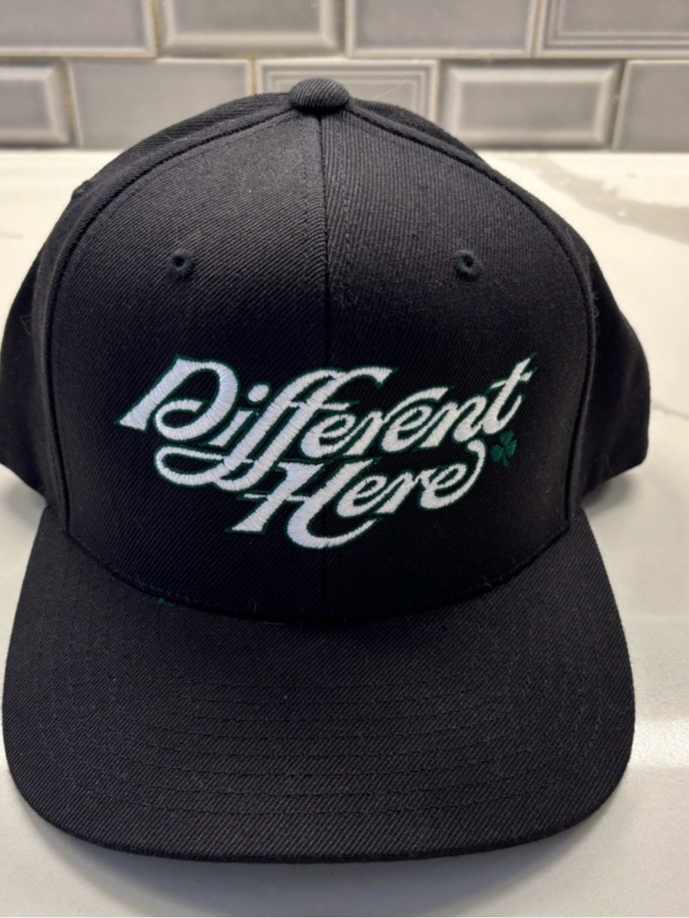 Celtics Black 'Different Here' Embroidered Snapback Hat